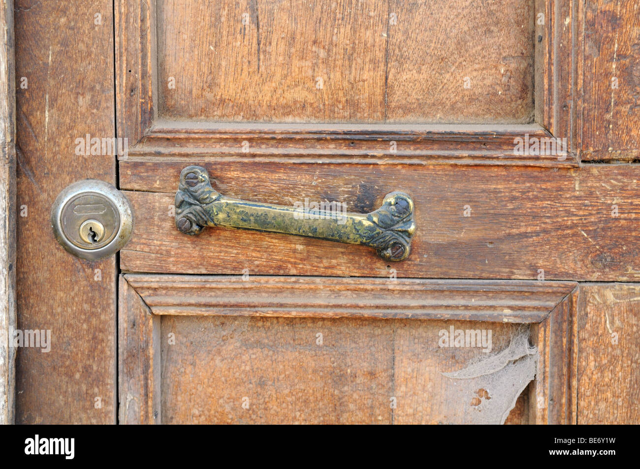 Detail of old door with lock and metal handle Stock Photo