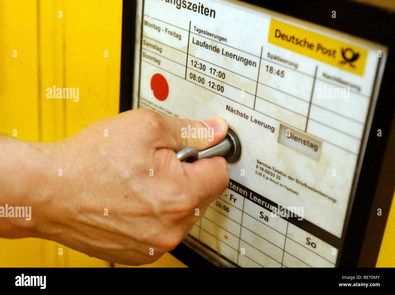 Emptying of a mailbox in downtown Stuttgart, Baden-Wuerttemberg, Germany, Europe Stock Photo