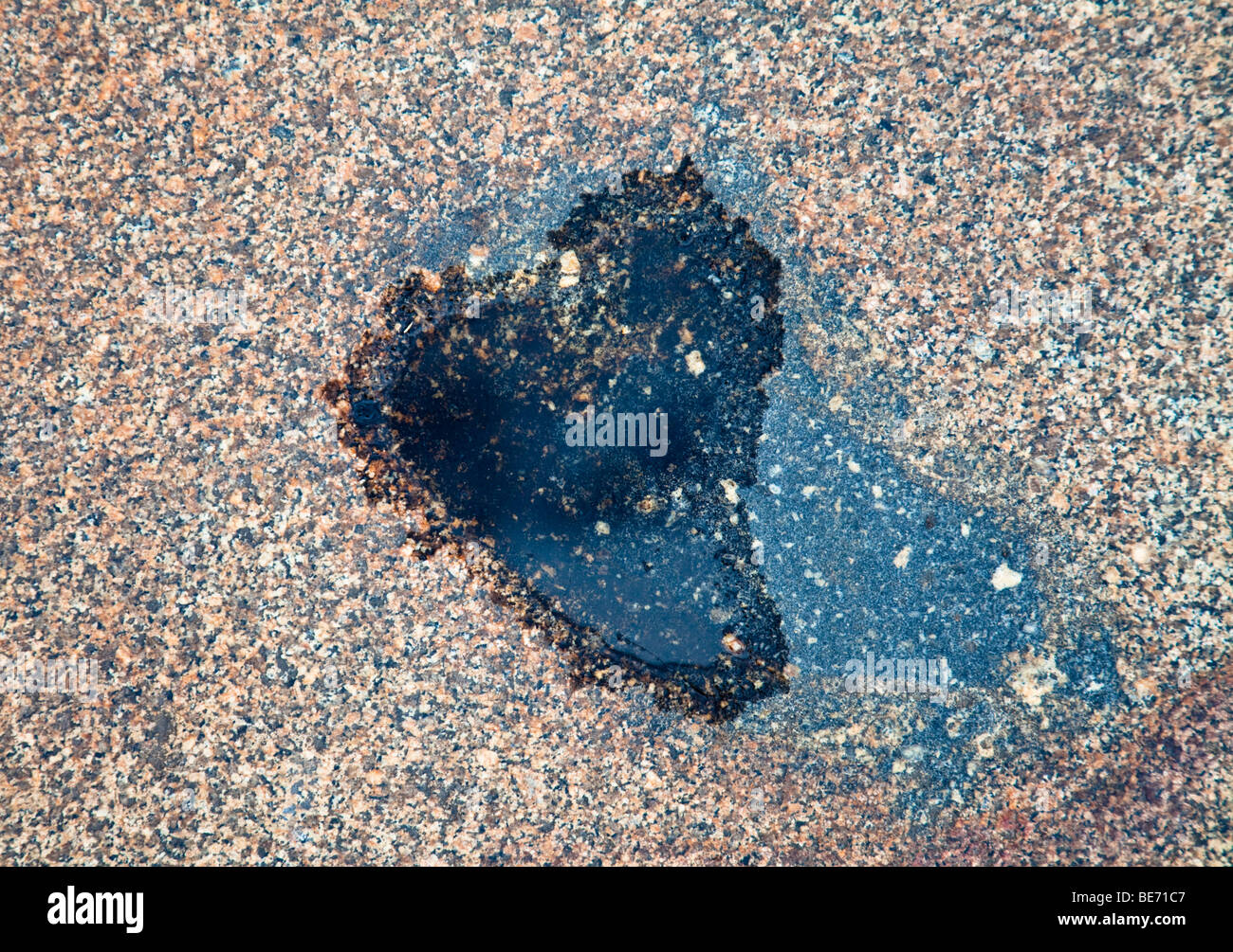 Heart-shaped puddle Stock Photo
