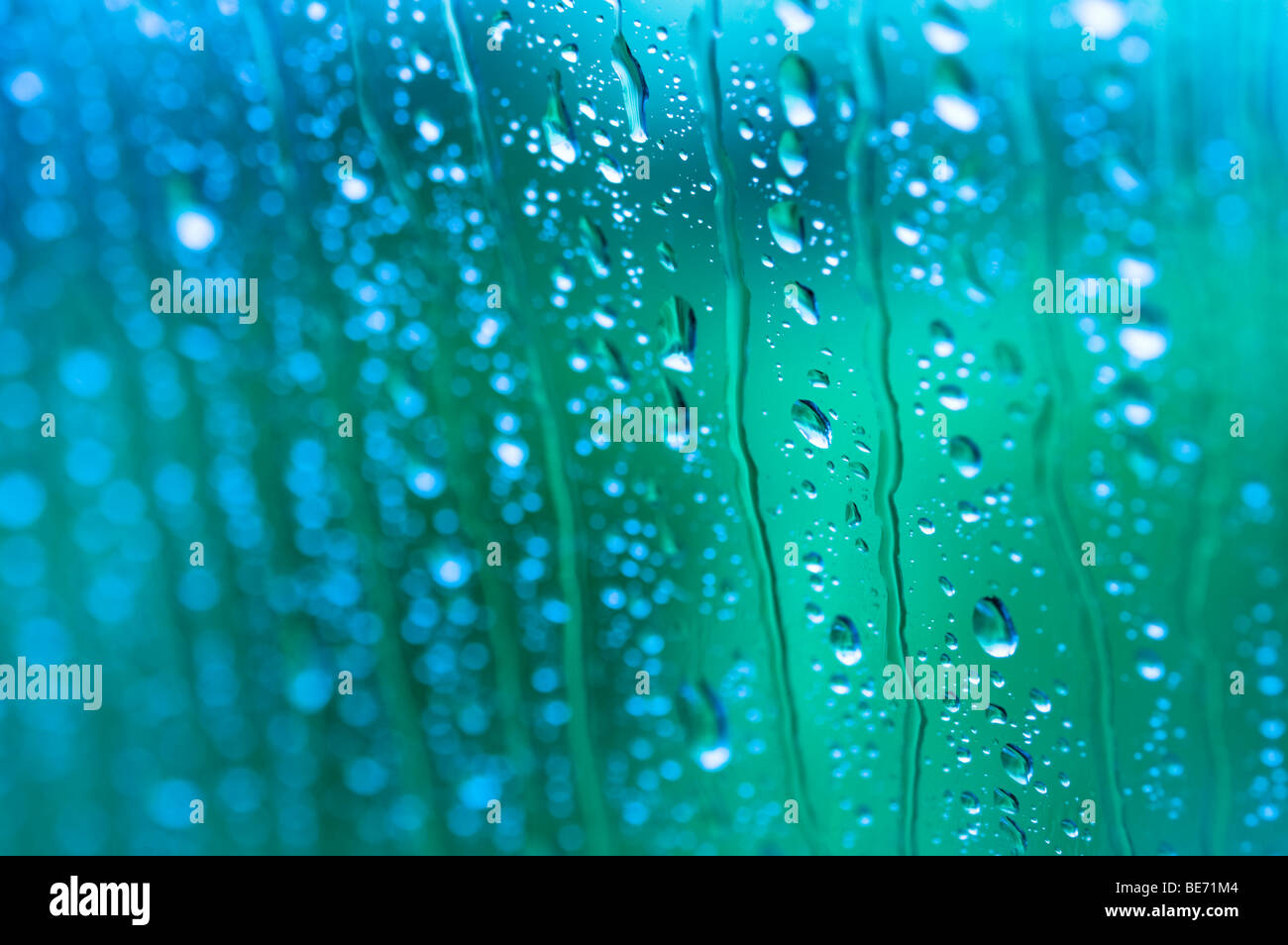 Rain drops on glass with selective focus Stock Photo