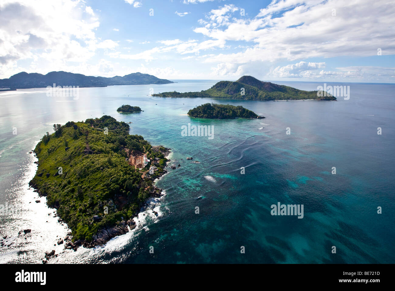 The islands of Ile Lounge, in the back the islands of Ile Ronde and Ile Moyenne in front of Mahe Island, Seychelles, Indian Oce Stock Photo