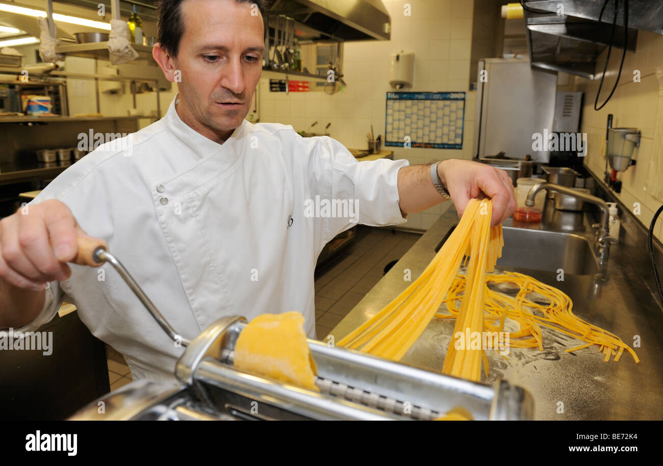 Cook making fresh pasta Stock Photo