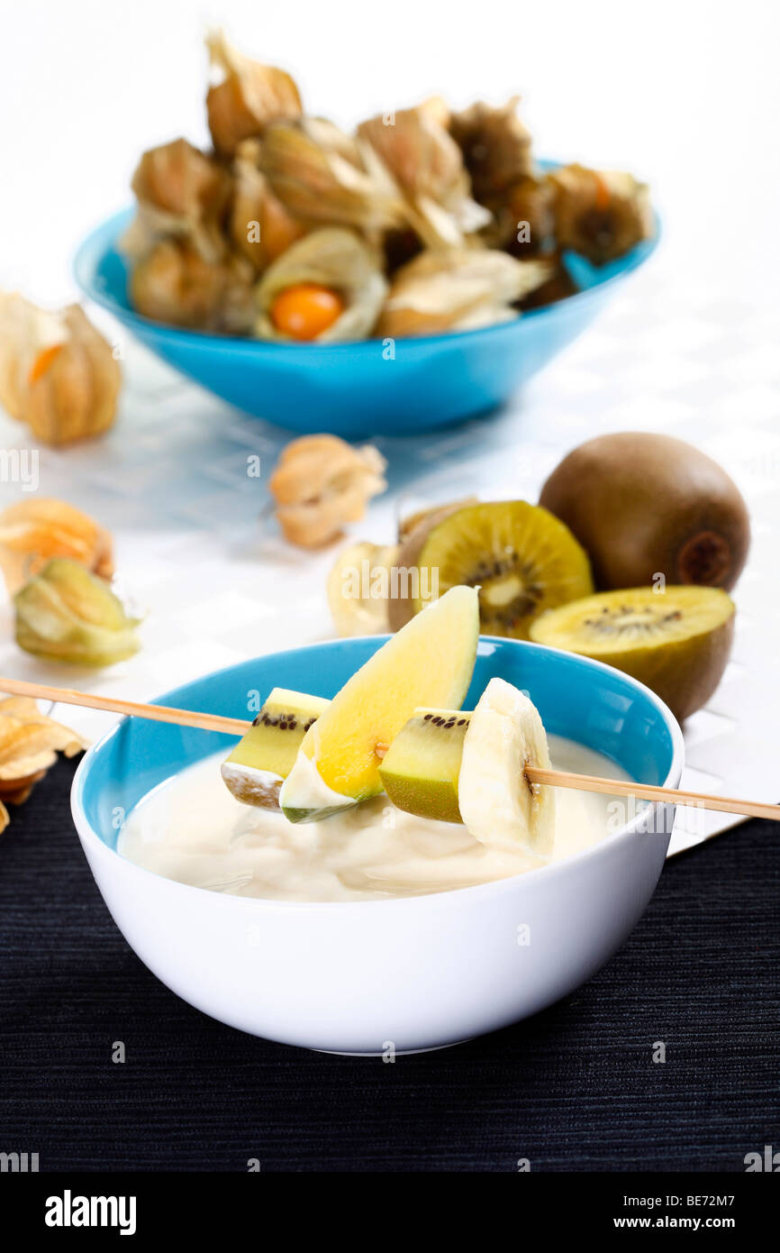 Vanilla yogurt with fruits on a skewer Stock Photo