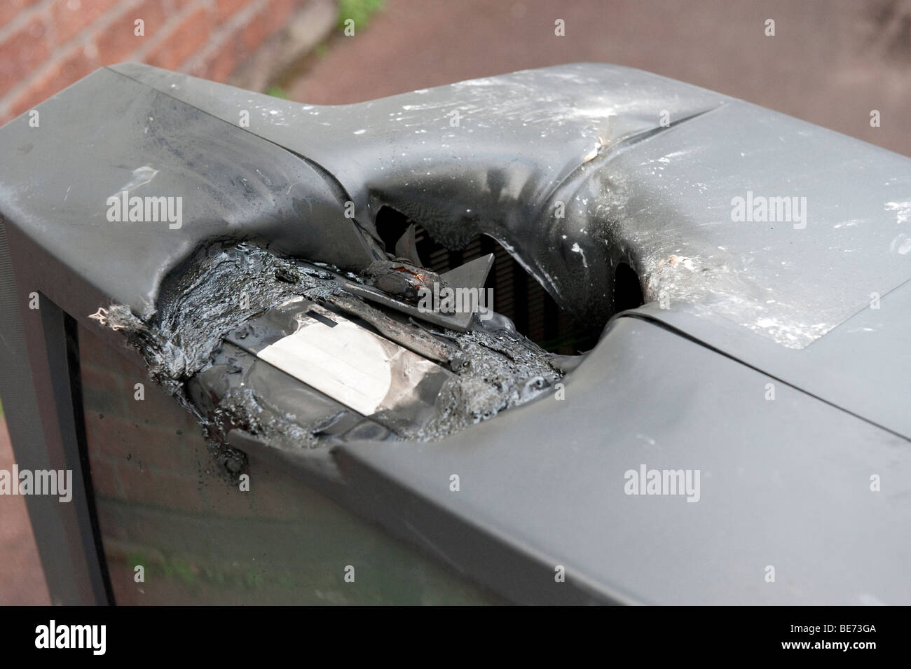 Melted television from having tea light candle left on it to burn