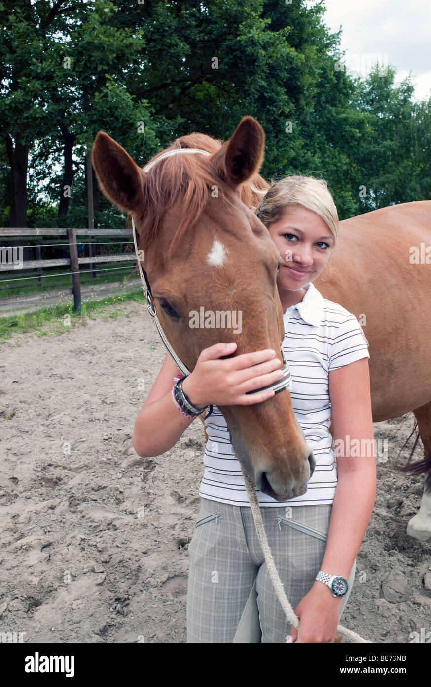 Teenage girl with a horse Stock Photo