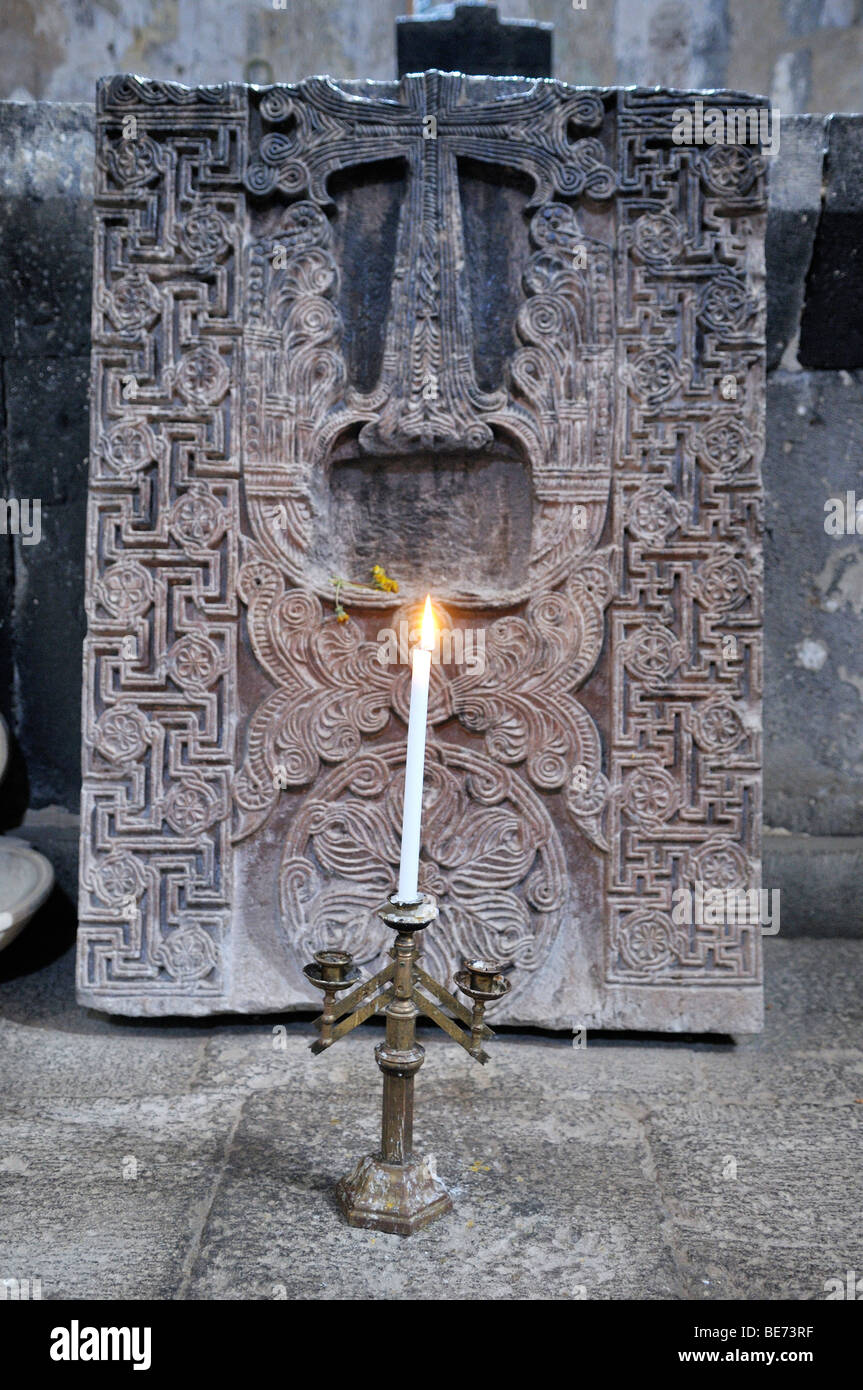 Candleholder and historic cross-stone, khachkar in the Armenian Orthodox church of St. Hripsime, UNESCO World Heritage Site, Ec Stock Photo