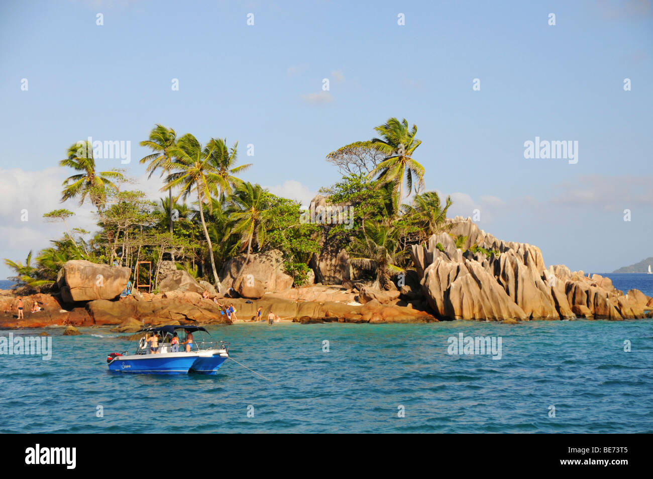 Excursion boat in front of St. Pierre Islet near Praslin Island, Seychelles, Africa, Indian Ocean Stock Photo