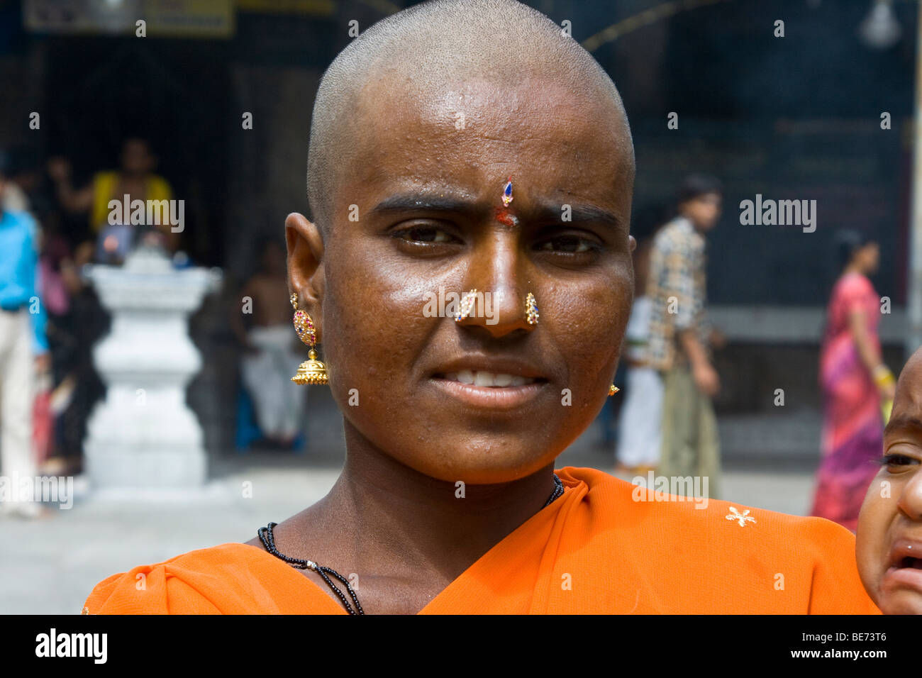 Woman with shaved head at Sri Jalagandeeswarar Temple inside Vellore
