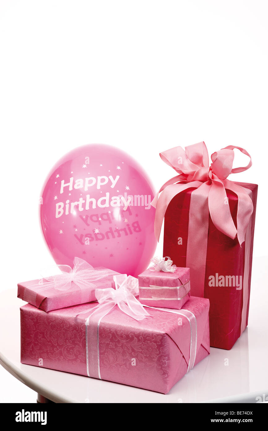 Presents with ribbons and a balloon, Happy Birthday Stock Photo