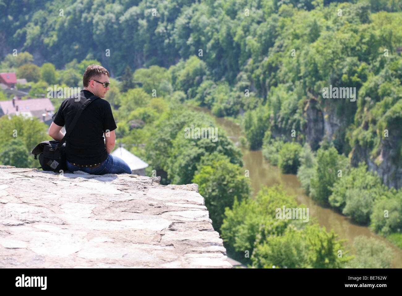 Sitting alone at the top of the precipice Stock Photo