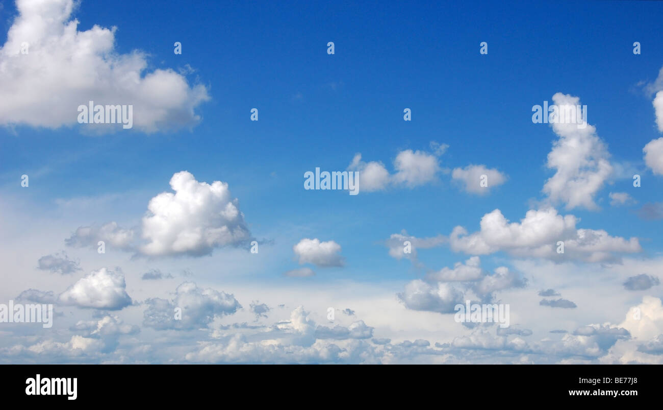 Blue sky with fluffy clouds in sunshine day, panoramic picture Stock Photo