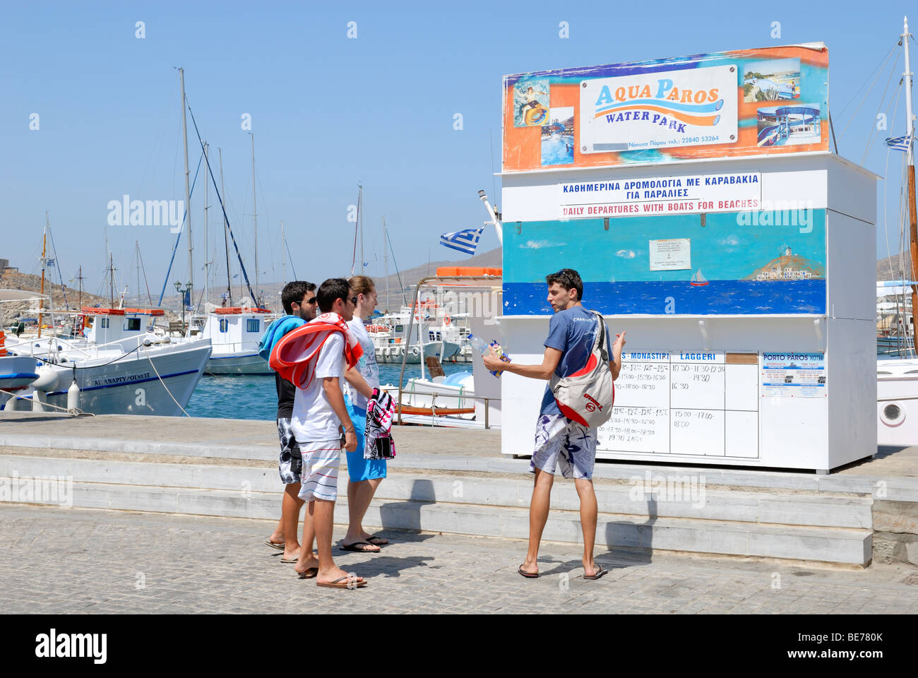 The Naousa town has a little west beach, but the boats run from the harbour of Naousa to beaches around the bay. The tourists... Stock Photo