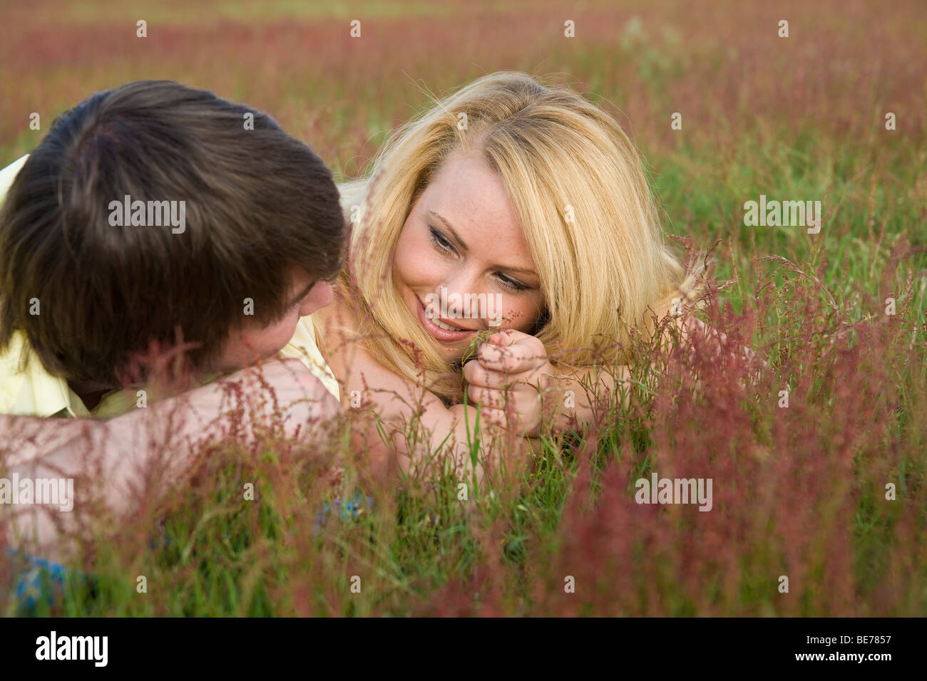 Young couple in love lies hi-res stock photography and images - Alamy