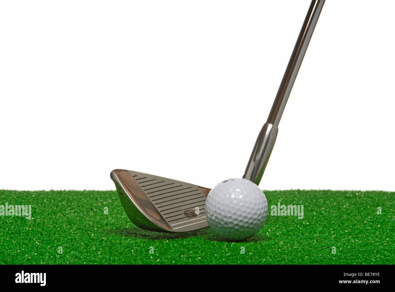 Golf club and ball on artificial turf Stock Photo