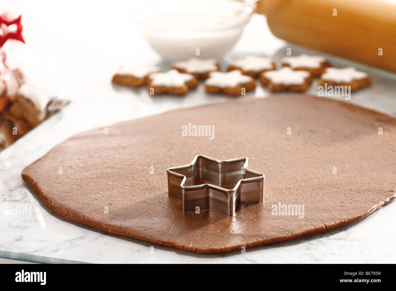 Cutting out cinnamon cookies Stock Photo