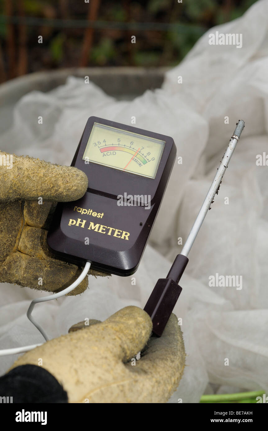 holding a soil ph meter Stock Photo Alamy