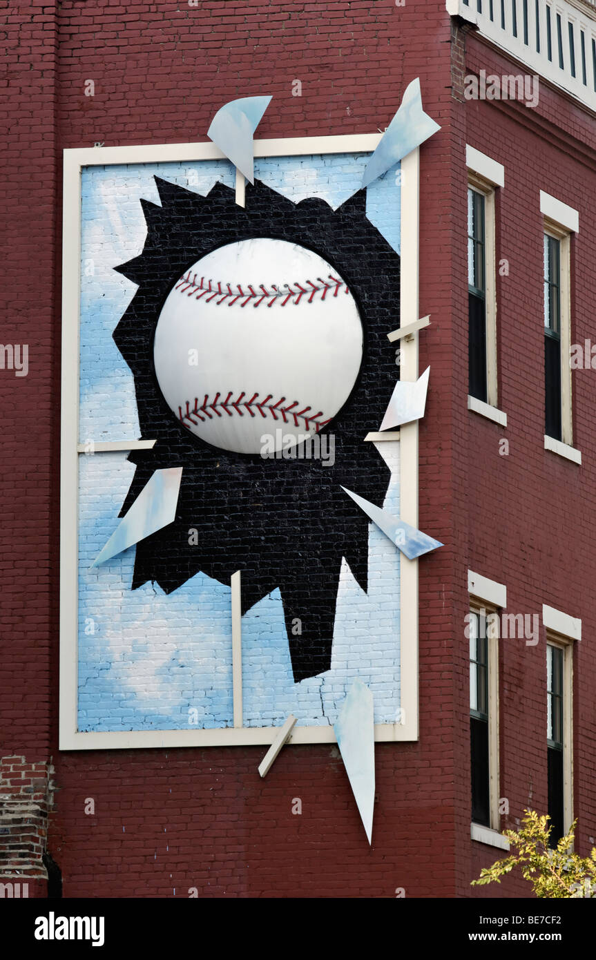 Funny Sign of Three Diminsional Baseball Breaking Window on Side of Building in Louisville, Kentucky Stock Photo