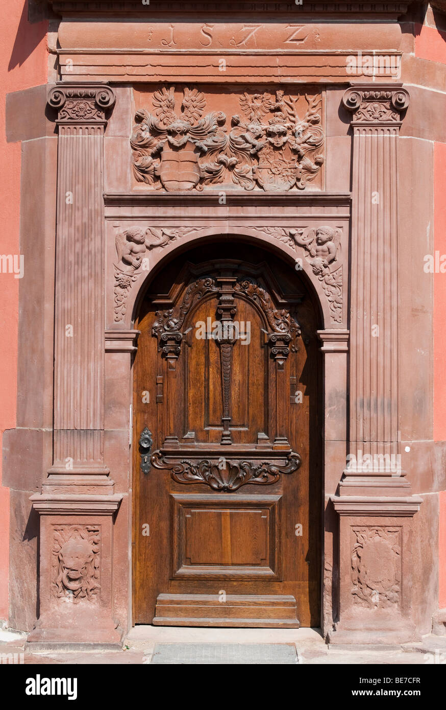 Door with emblem of the House of Isenburg, Isenburg Castle, renaissance facade with arcades, part of the campus of the Universi Stock Photo