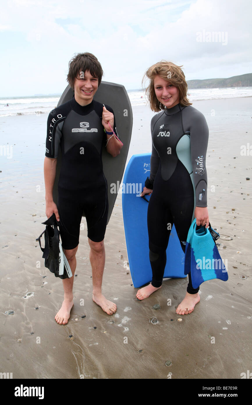 Model Released Picture Of Teenage Boy Girl Twins In Wetsuits On Beach Newgale Sands Pembrokeshire Wales Uk Stock Photo Alamy