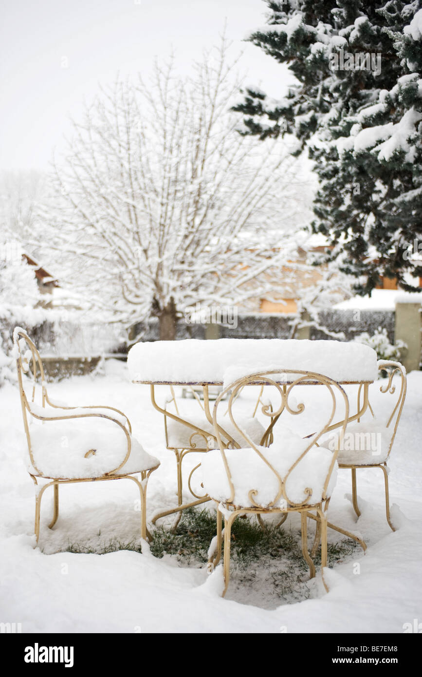 Patio furniture covered with thick layer of snow Stock Photo Alamy