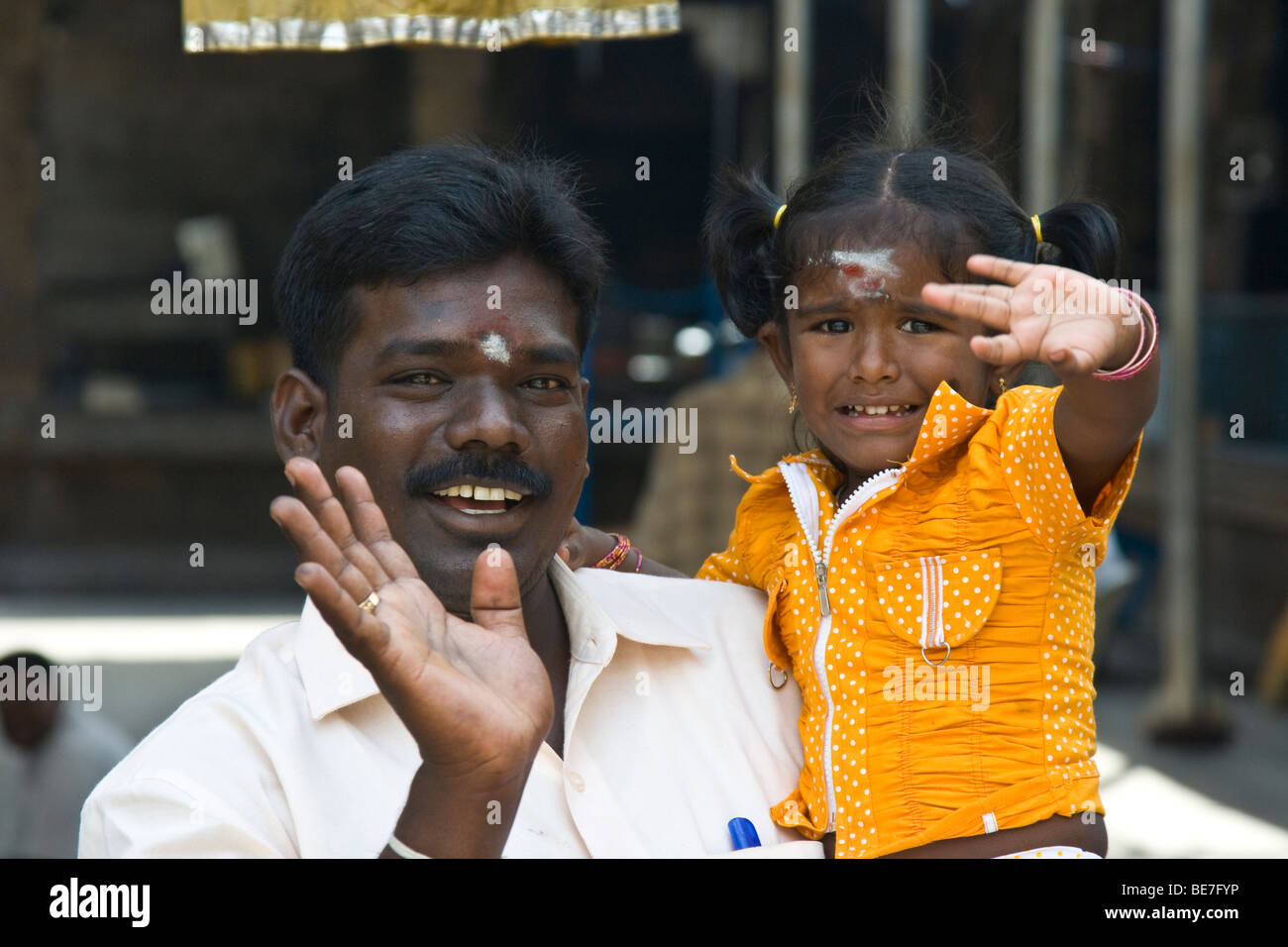Hindu father and freightened daughter at Sri Jalagandeeswarar Temple inside Vellore Fort in Vellore India Stock Photo