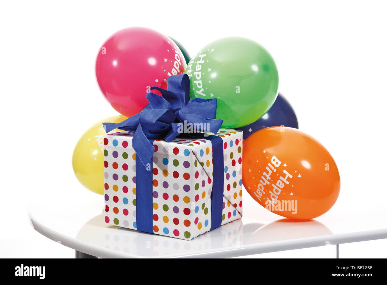 Present with a ribbon and balloons, Happy Birthday Stock Photo