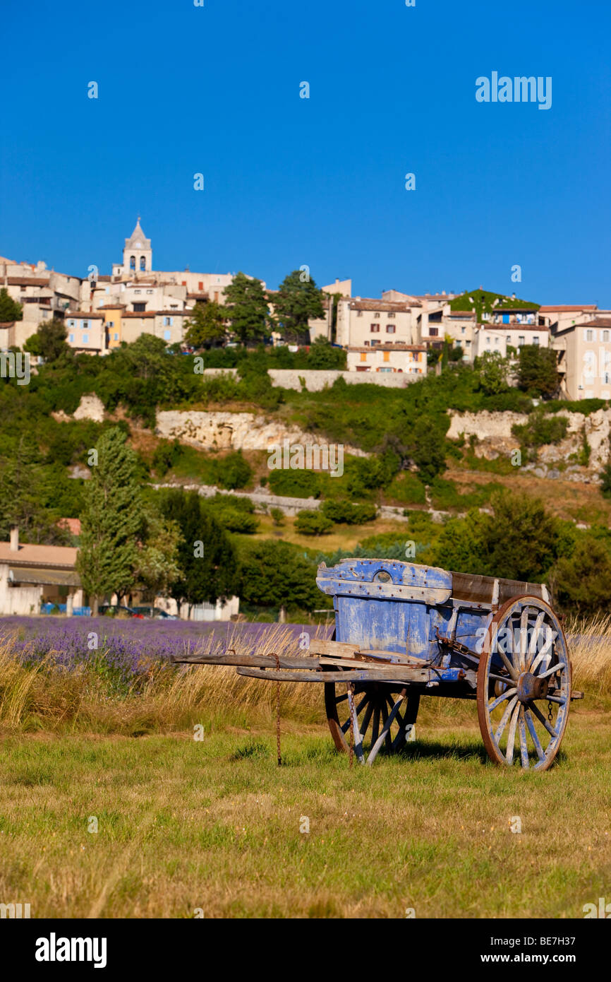 Old lavender harvesting cart in farmers field with the town of Sault beyond, Provence France Stock Photo
