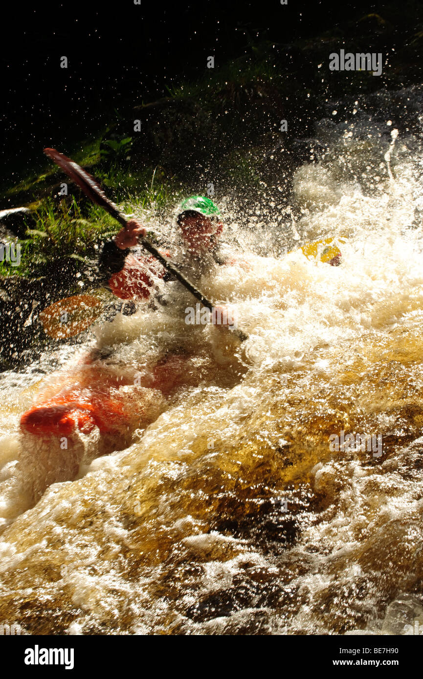 A man kayaking on the Tryweryn river, National White Water Centre
