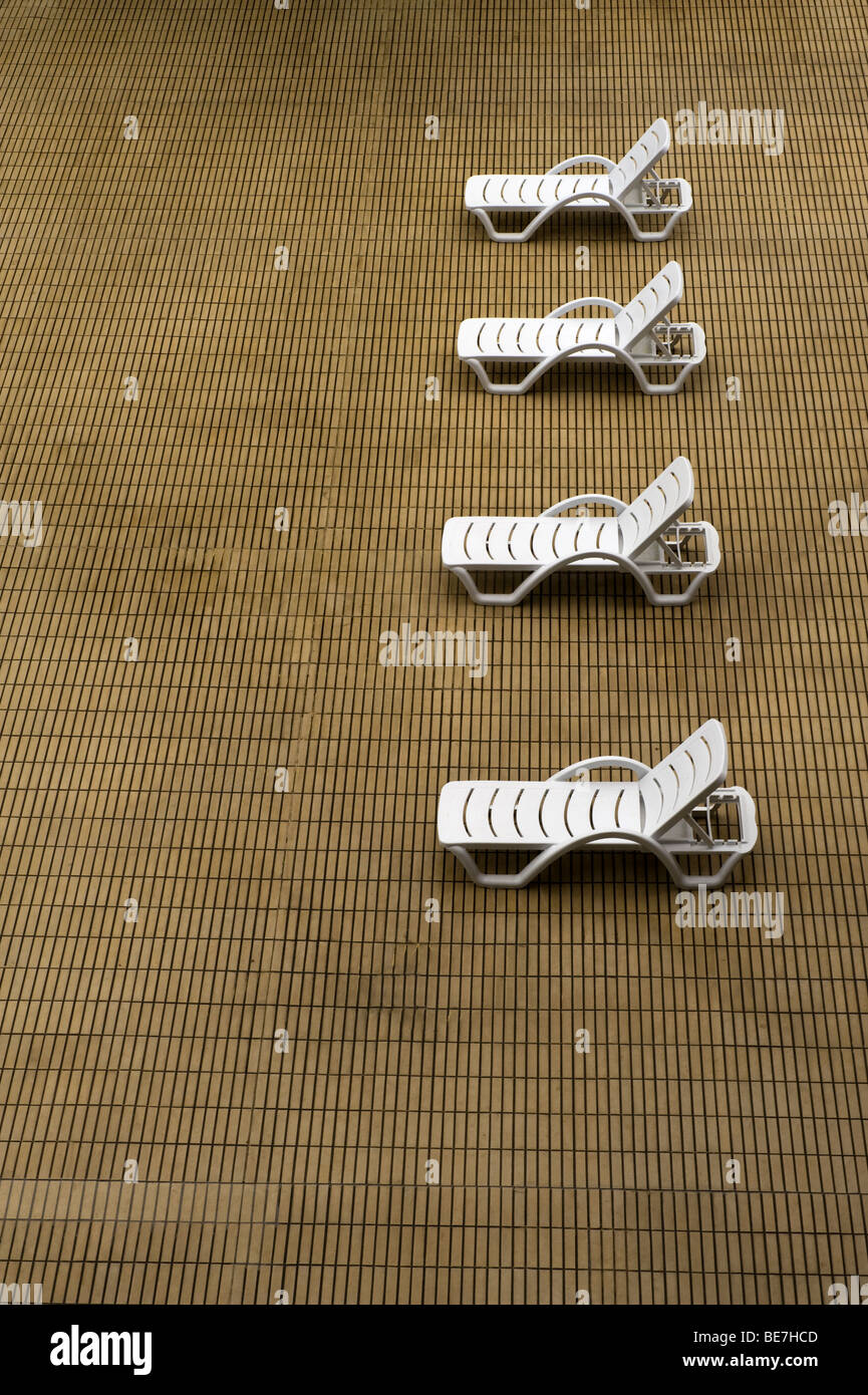 Lawn chairs on a sun deck Stock Photo