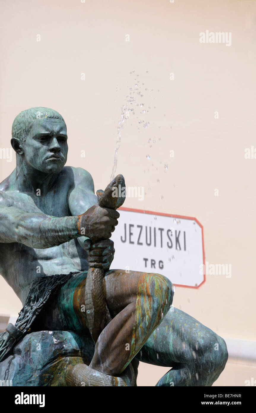 Zagreb, Croatia. Bronze Statue 'Fisherman and Snake' (Simeon Roksandic; 1908) in Jezuitski trg (square) Stock Photo
