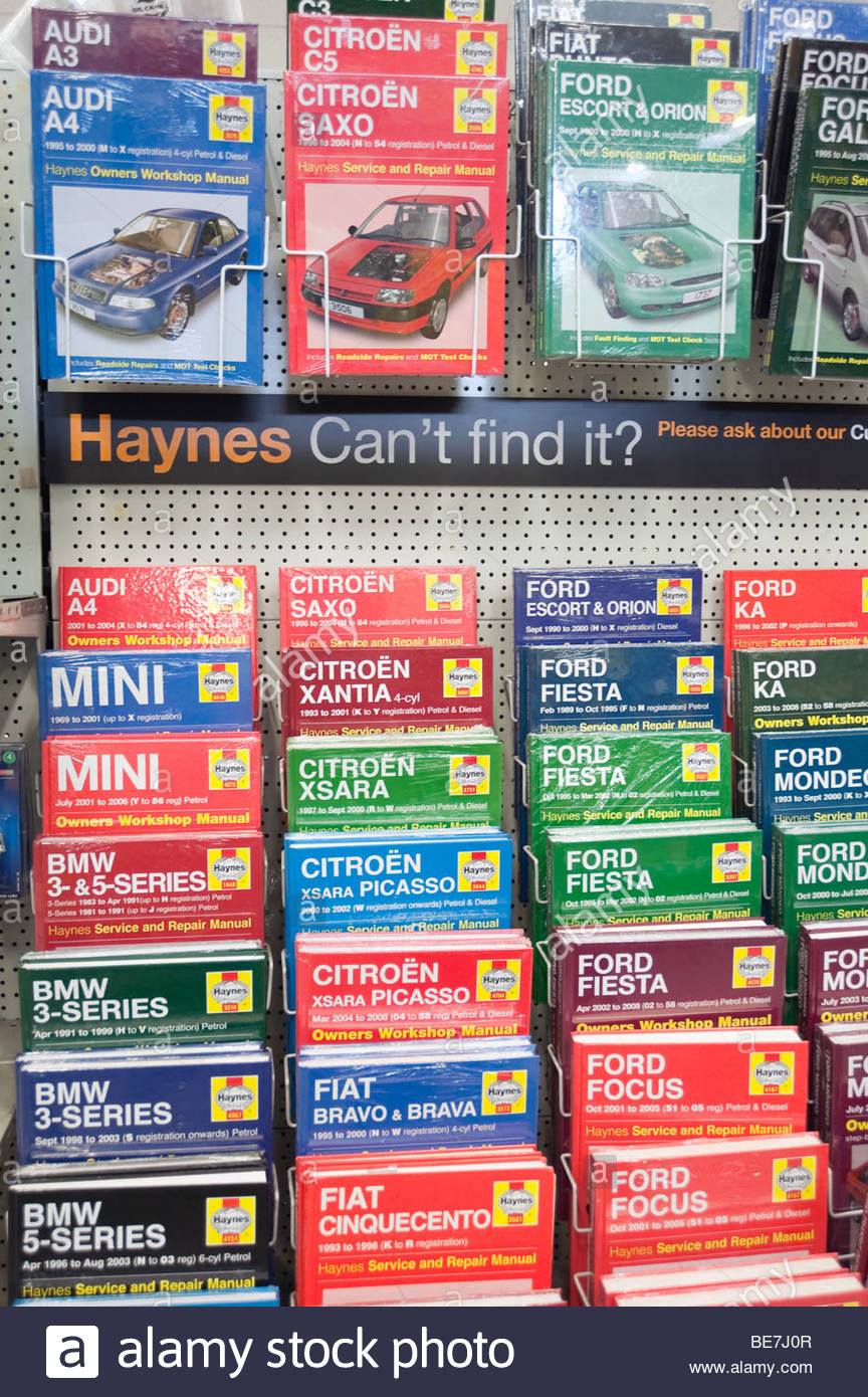 Haynes car manuals for sale in a shop. - Stock Image