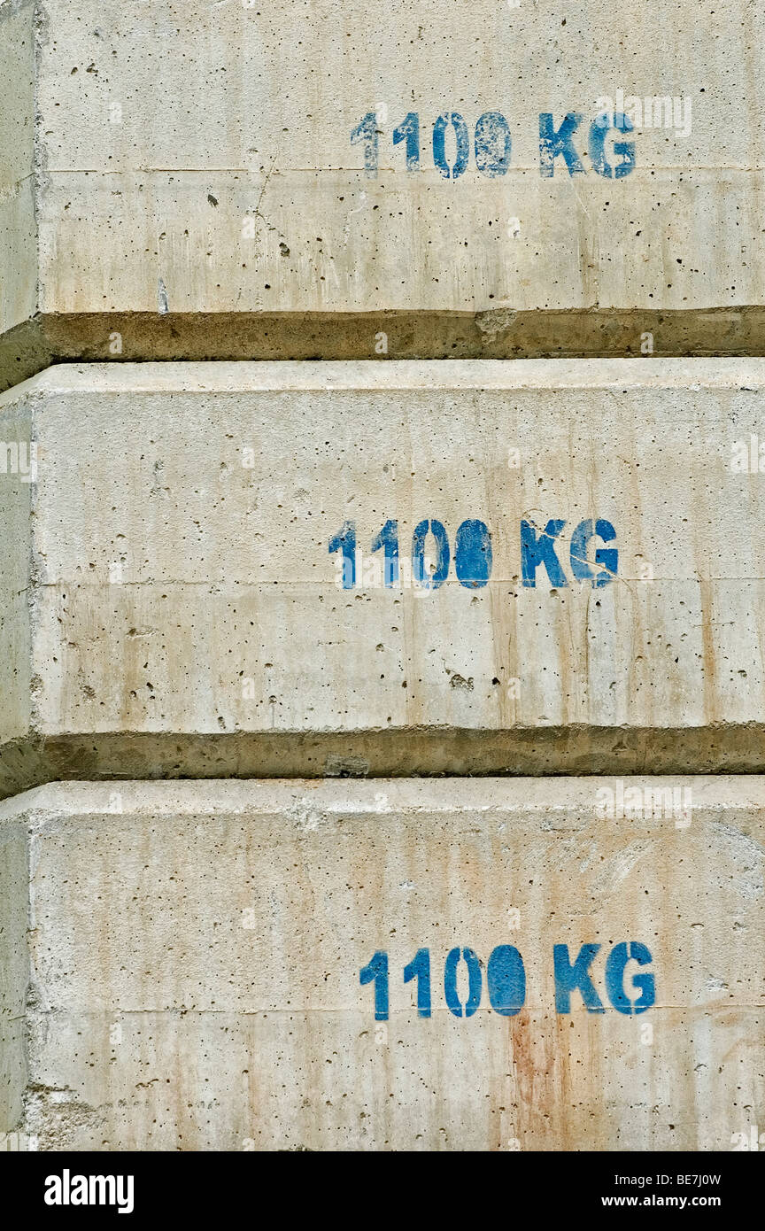 Concrete counterweight blocks used in building construction Stock Photo