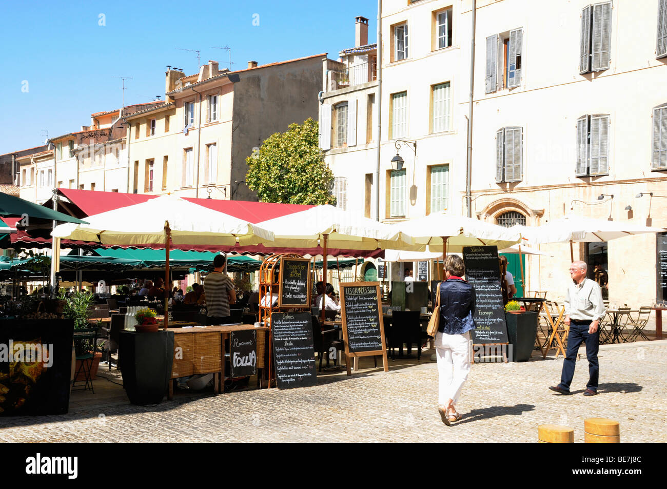 La Place des cardeurs, Aix en Provence. French cafe dining outside, lunch service begins as
