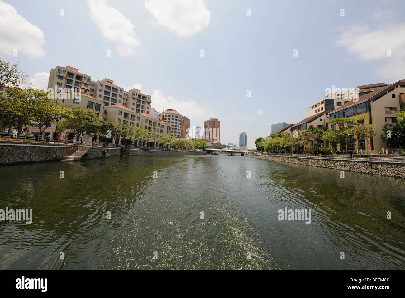 looking down the Singapore River past residential area towards Liang Court and the Novotel at Clarke Quay. Singapore Stock Photo