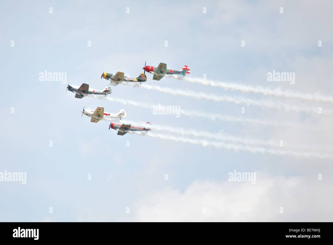 Airplanes performing aerobatic stunt at airshow Stock Photo