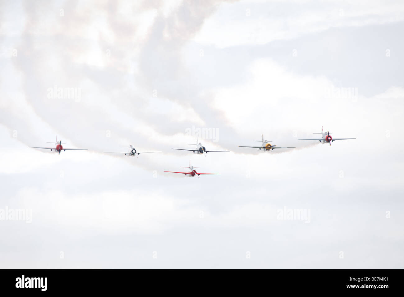 Airplanes performing aerobatic stunt at airshow Stock Photo