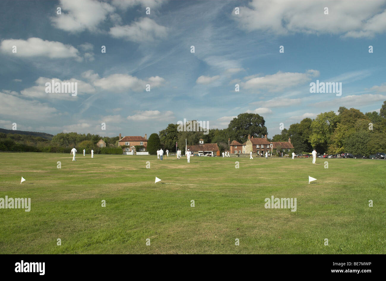 Lurgashall village green sees a game of cricket on a warm sunny autumn day. Stock Photo