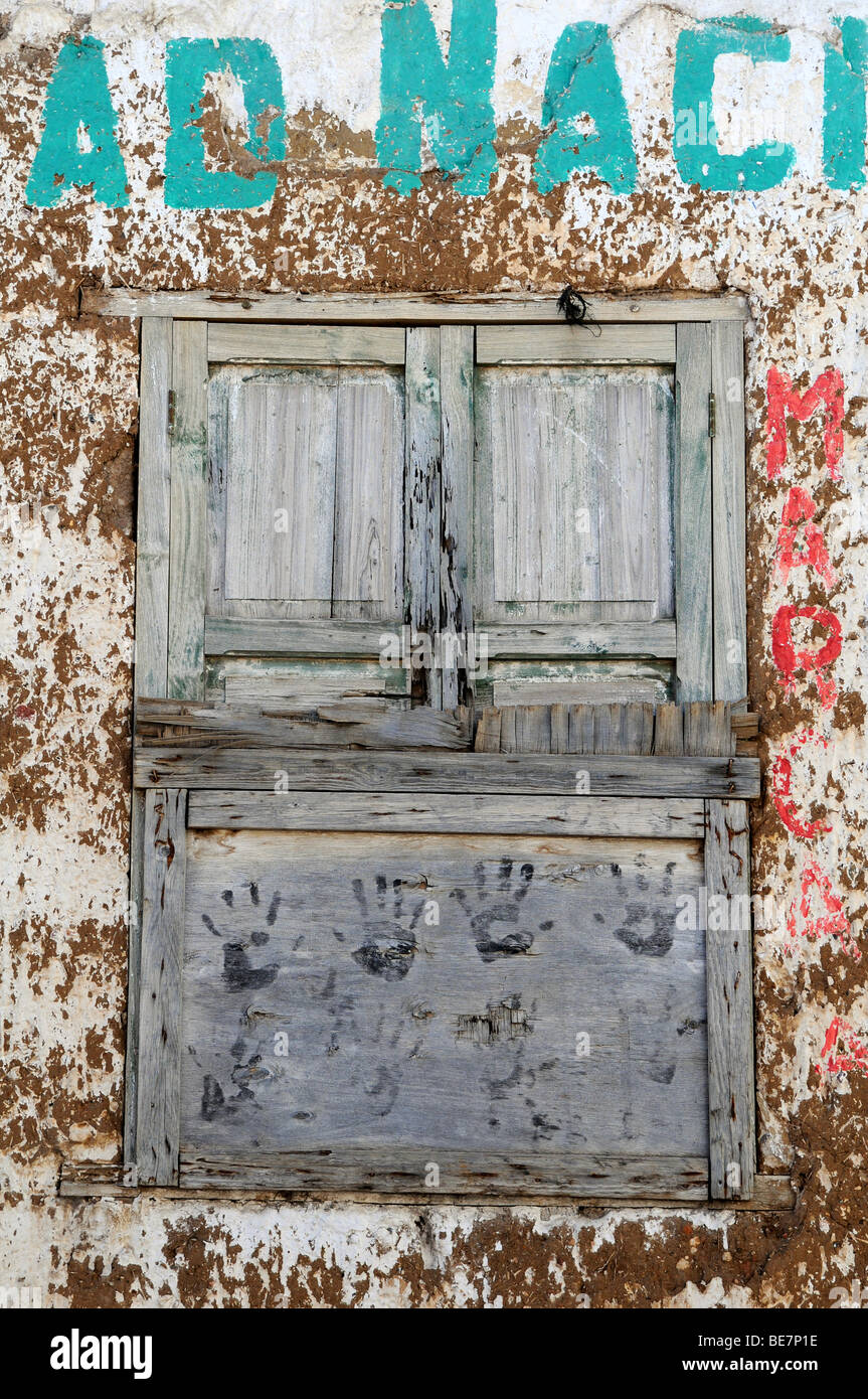 Old grunge window with paint peeling from walls Stock Photo