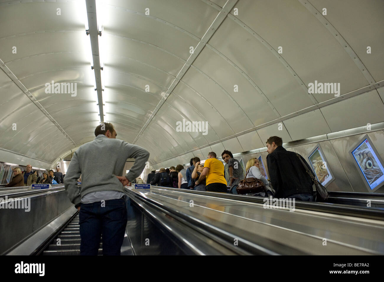 Commuters travelling up an escalator on the London Underground Tube system. Photo by Gordon