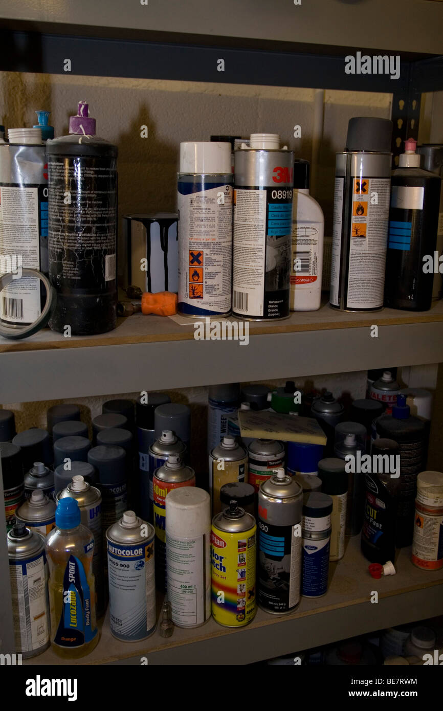 Collection of aerosol cans and polishes in a garage Stock Photo Alamy