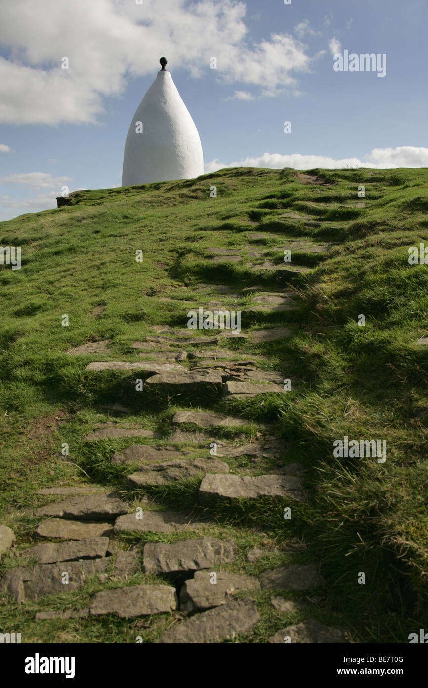 Town of Bollington, England. Gritstone Trail path leading to the Grade II Listed White Nancy folly. Stock Photo