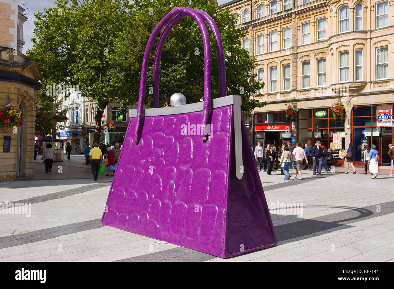 Giant handbag in shopping street to promote opening of new John Lewis store in Cardiff South Wales UK Stock Photo
