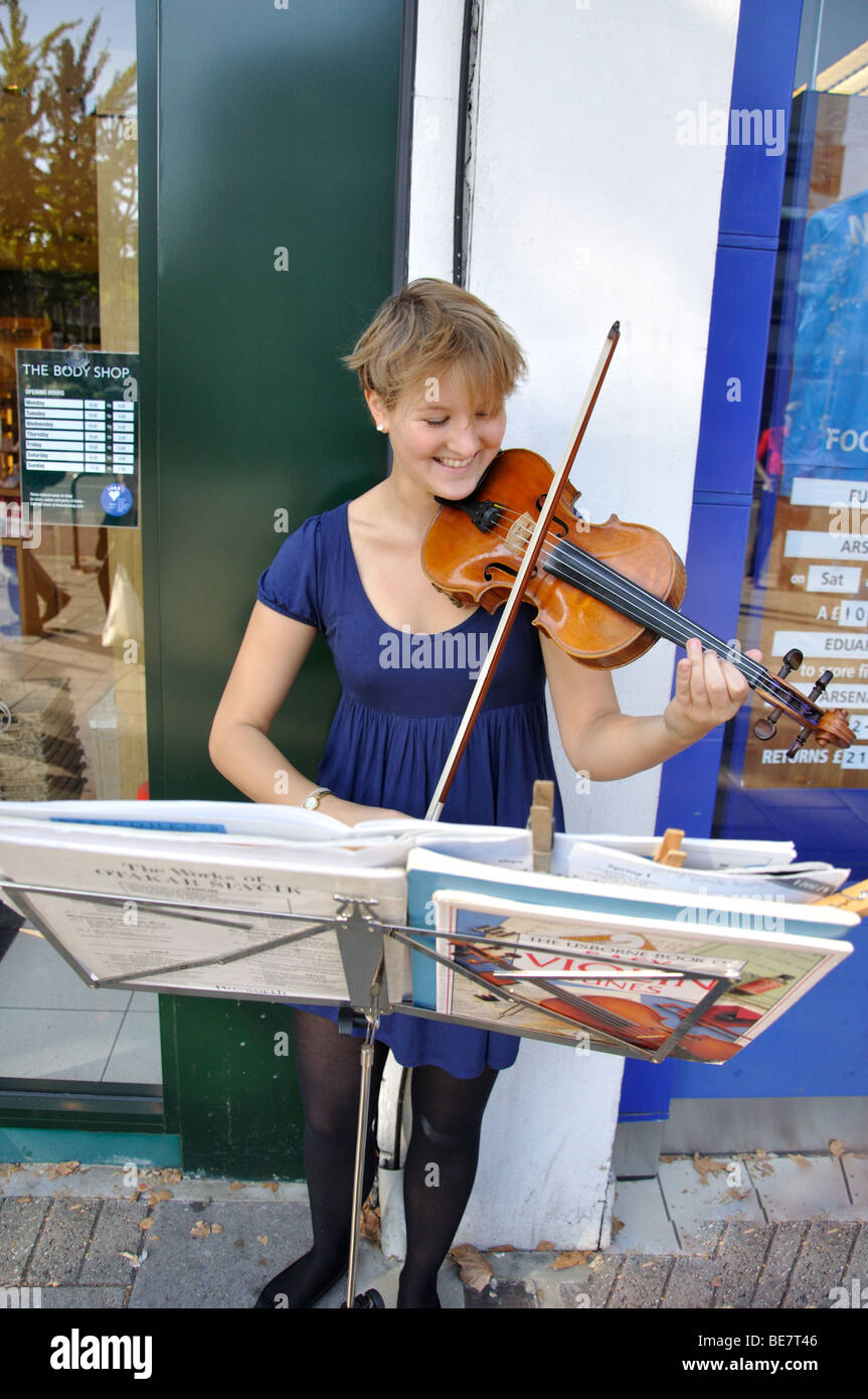 Young woman busker, Chiswick High Road, Chiswick, London Borough of Hounslow, Greater London, England, United Kingdom Stock Photo