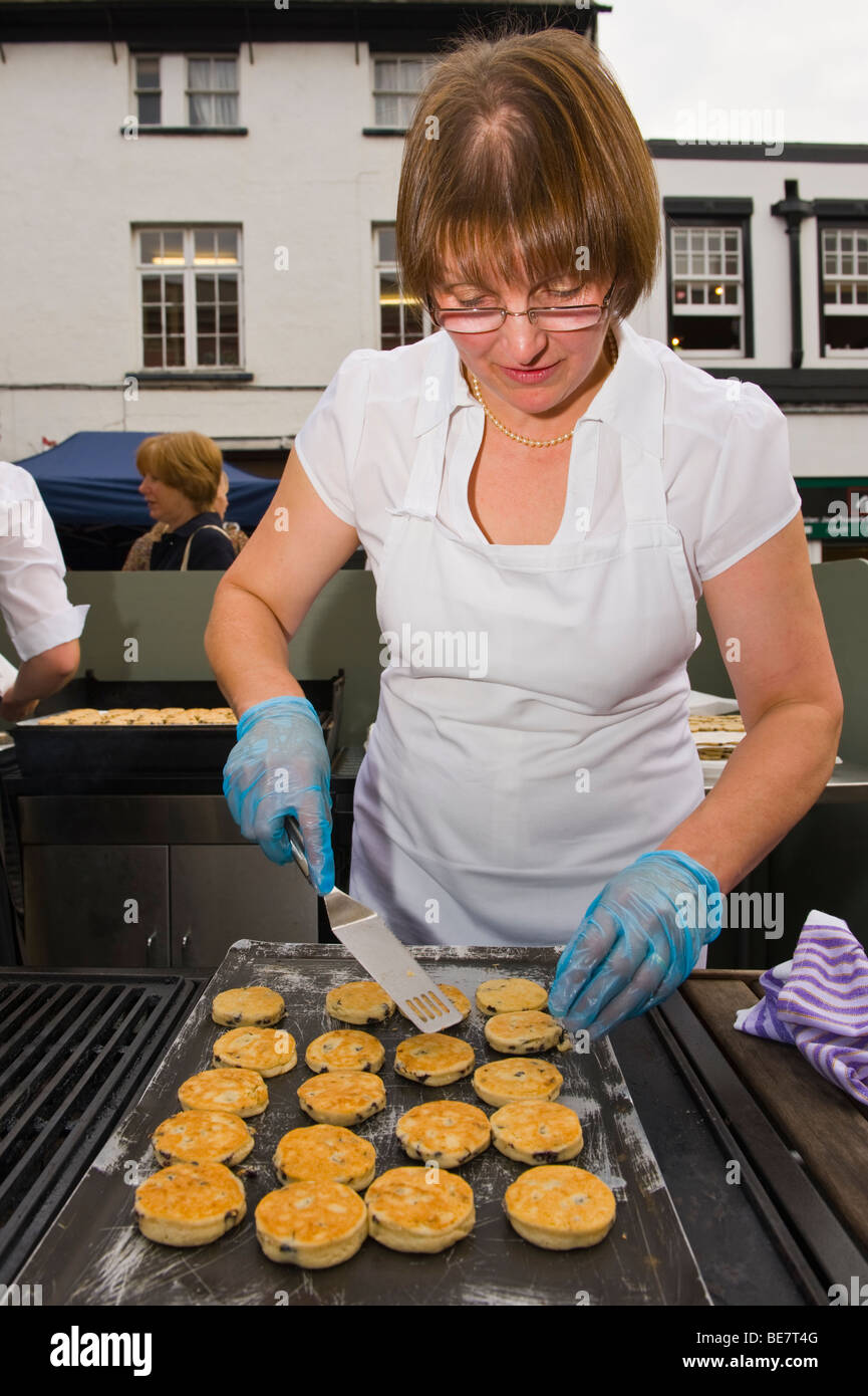 Cooking Welsh cakes on a griddle outside at Abergavenny Food Festival