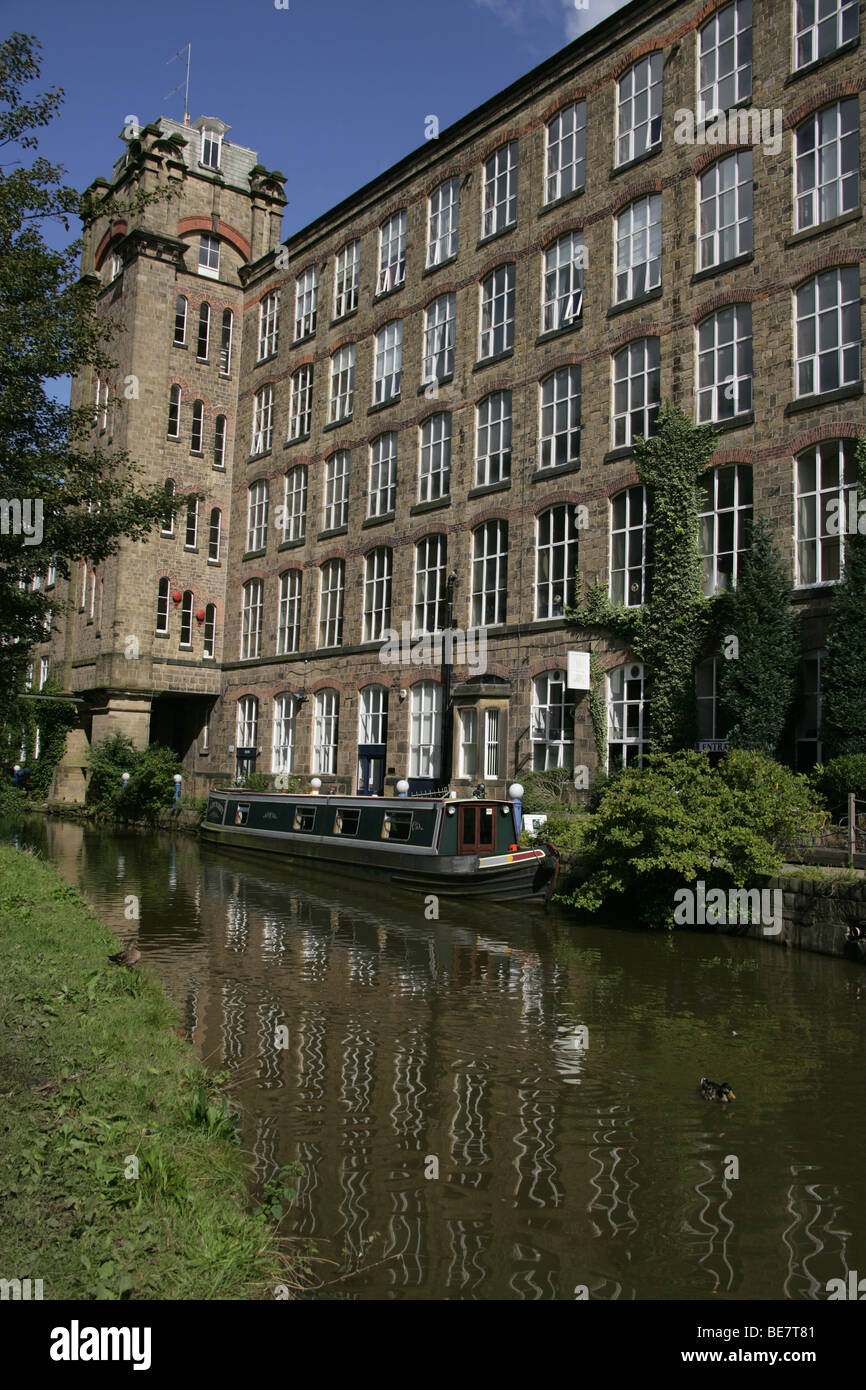 Town of Bollington, England. View of Bollington’s Clarence Mill by the banks of Macclesfiled Canal. Stock Photo
