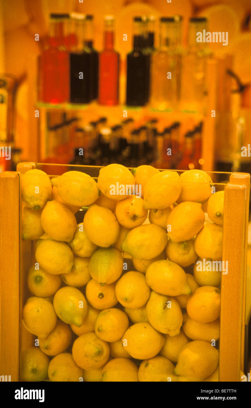 Assorted lemons in glass at shopping mall fruit lemonade stand Stock