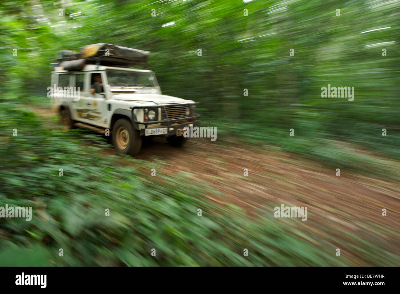 Land Rover Defender in the Budongo Forest Reserve in Uganda. Stock Photo