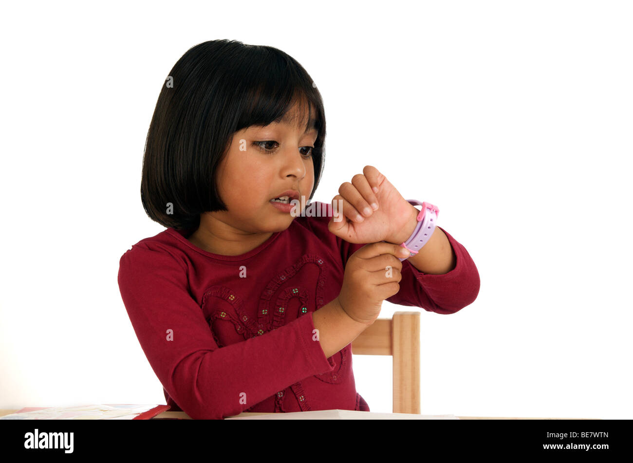 Young girl is checking time worried Stock Photo - Alamy