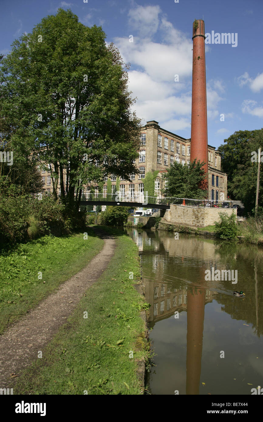 Town of Bollington, England. View of Bollington’s Clarence Mill by the banks of Macclesfiled Canal. Stock Photo