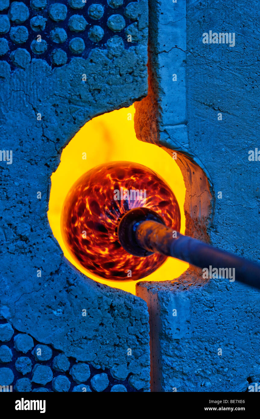 A Piece of Blown Glass being Reheated in Gas Furnace Stock Photo